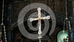 OROPA, BIELLA, ITALY - JULY 7, 2018: close up, golden cross with crucifixion of Christ on the altar in the catholic