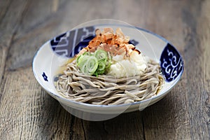 Oroshi soba, Japanese chilled buckwheat noodles topped with grated daikon radish is eaten with soba soup.