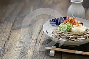 Oroshi soba, Japanese chilled buckwheat noodles topped with grated daikon radish is eaten with soba soup.