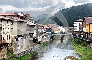 Orozko village in Basque Country with river and a bridge photo
