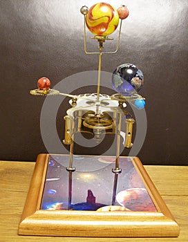 Orrery steampunk art clock with planets of the solar system.