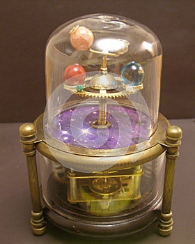 Orrery steampunk art clock with planets of the solar system.