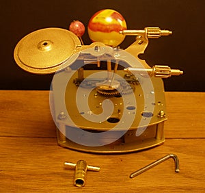 Orrery steampunk art clock with planets of the solar system.