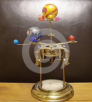 Orrery steampunk art clock with planets of the solar system.