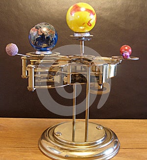 Orrery steampunk art clock with planets of the solar system.