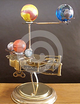 Orrery steampunk art clock with planets of the solar system.