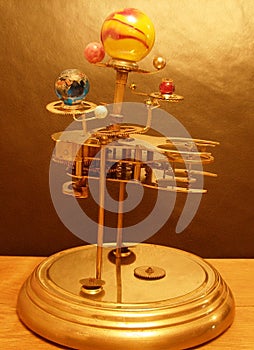 Orrery steampunk art clock with planets of the solar system.