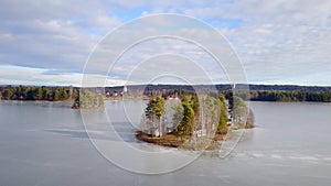 Island and town of Orsa  from above at frozen lake Orsa in Sweden photo
