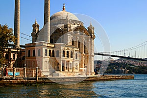 Ortakoy Mosque on the shores of the Bosphorus with the Bosphorus Bridge in the background in Istanbul, Turkey
