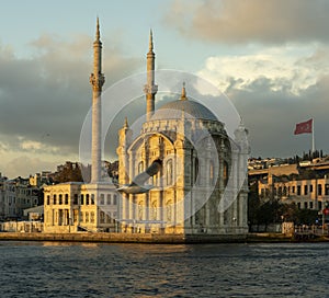 OrtakÃÂ¶y Mosque and seagull sunset