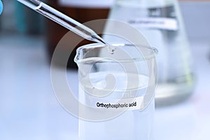 ortho phosphoric acid in bottle , chemical in the laboratory and industry