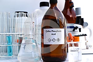 ortho phosphoric acid in bottle , chemical in the laboratory and industry photo