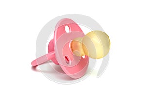 Orthodontic pacifier isolated on a white. Pink baby`s pacifier isolated on white background