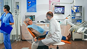 Orthodontist discusses an MRI scan with patient