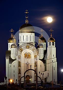 Orthodox cathedral in Magnitogorsk and full moon