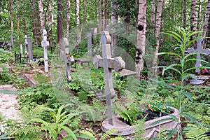 Orthodox cemetery. Graves with crosses, tombstones. Clear sunny weather.