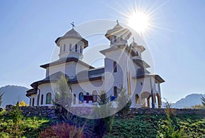 An orthodox chirstian church in Ponoarele, Romania, a spiritual place of worship, traditional romanian style white church in the