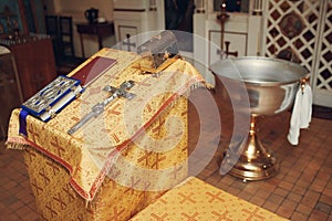 Orthodox Christian Cross, Holy Bible and utensils in the church. Epiphany ceremony rite.