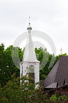 Orthodox church against the background of forest and sky in a monastery in the north of Moldova.