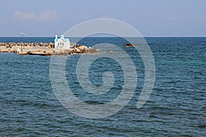 orthodox church (agios dionysios d\'olymbos) and mediterranean sea in galatas in crete