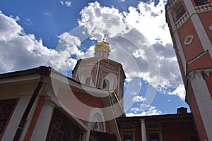 Orthodox Church on the background of blue sky and bright sun photo