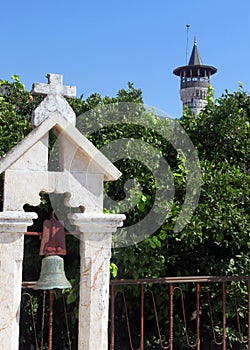 Orthodox Church and behind minaret, Hatay Antioch, Turkey photo