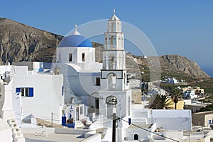 Orthodox church and bell tower in Pyrgos, Santorini, Greece.