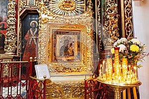 Orthodox Church. Christianity. Festive interior decoration with burning candles and icon in traditional Orthodox Church on Easter