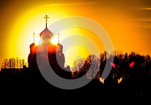 Orthodox Church in honor of Saint George in the Kaluga region (Russia) at sunset.