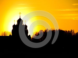 Orthodox Church in honor of Saint George in the Kaluga region (Russia) at sunset.