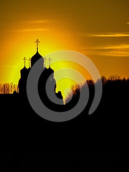 Orthodox Church in honor of Saint George in the Kaluga region (Russia) at sunset.