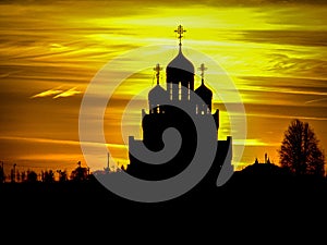 Orthodox Church in honor of Saint George in the Kaluga region (Russia) at sunset.