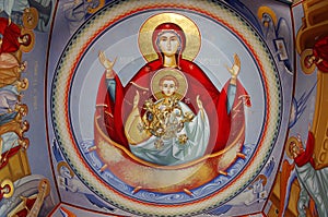 Orthodox church. Painting on the ceiling with Virgin Mary and Child - Bujoreni Monastery, landmark attraction in Romania