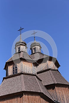 Orthodox church in Ukraine, old church on blu sky the background. Old temple made of wood . religion