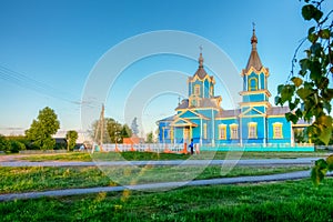 Orthodox church in the village of Red Partisans at sunset