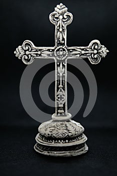 Orthodox cross isolated on plain black background