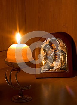 Orthodox Family icon and flaming candle