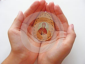 Orthodox icon in children hands close up photo