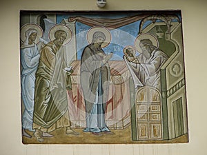 The Orthodox icon is a fresco on the wall of a Russian Orthodox Church.