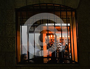 Orthodox lighting candles of hanukia during the jewish holiday of chanuka