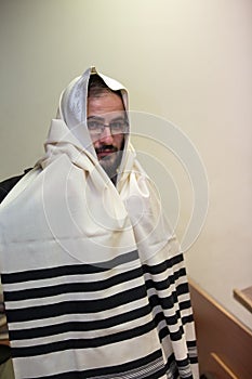 An orthodox wears a tallit photo
