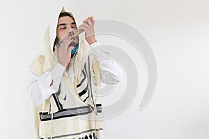 Orthodox Jewish man blowing the horn for the  Rosh Hashanah holiday