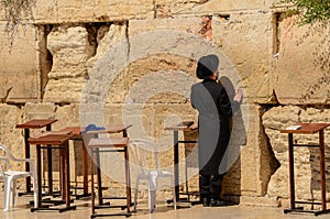 Orthodox Jewish man praying at Western Wall in Jerusalem, Israel