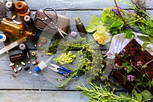 from orthodox medicine to natural medicine, from pills and drops to healing herbs with equipment on a rustic wooden table
