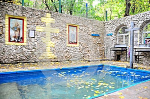 orthodox monastery Saharna, Republic of Moldova. ritually bathe, Water in the pool for believers photo