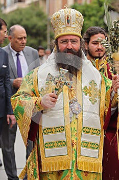 Orthodox priest wearing traditional vestments in a religious ceremony in Aleppo, Syria