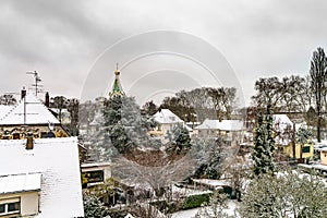 Orthodox russian church in Strasbourg, city roofs after snowfall