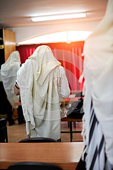 Orthodox ultra Orthodox Jew from a tallit in the synagogue Yom Kippur, Sukkot