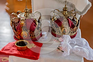 Orthodox wedding crowns and icons, essential in traditional marriage ceremonies. Representative of unity and spiritual commitment