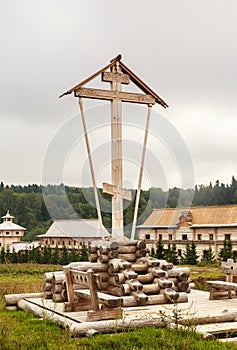 Orthodox wooden cross in the territory of the holy spring Gremyachiy key
